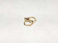 In the center: a pair of 14 karat gold handcuffs pendant laying flat - Popular Jewelry