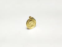 In the center: a portrait of Mary looking downher son Jesus in a 14 karat yellow gold medallion style pendant standing up facing vieweralternate angle made by Popular Jewelry in New York City