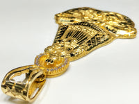 A 45 angle view from bail of Our Lady of Charity "Cardidad" 14K Yellow Gold Pendant laying flat - Popular Jewelry