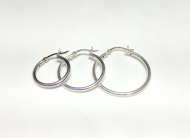 From left to right: three different individual smaller sized sterling silver earrings arranged from smallest to largest - Popular Jewelry