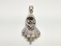 In the center: a white sterling silver hooded skeleton iced out with cubic zirconia in a beautiful micro pave setting made by Popular Jewelry in New York City