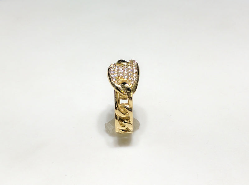 In the center: a 10 karat yellow gold gucci link style lady's ring set with cubic zirconia in a micro pave setting standing up with its side facing viewer made by Popular Jewelry in New York City