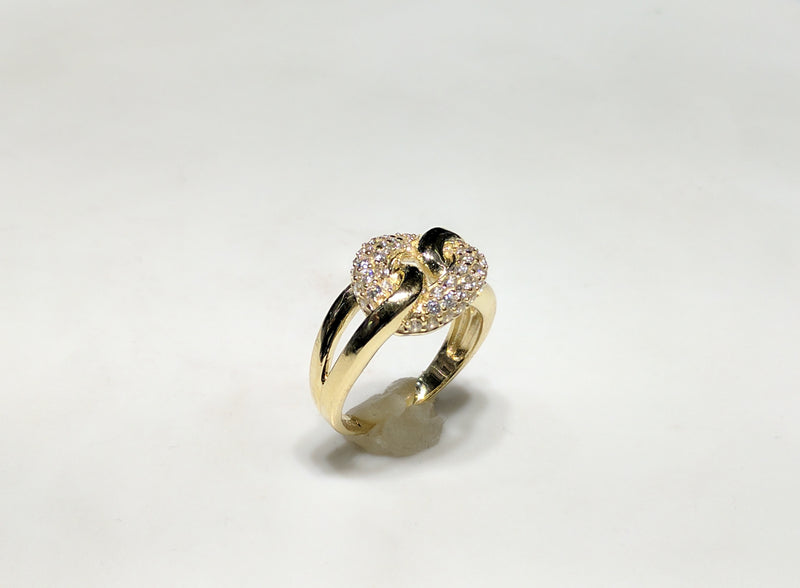 In the center: 10 karat yellow gold lady's puffy round link ring set with cubic zirconia in micro pave setting standing up facing the vieweran angle made by Popular Jewelry