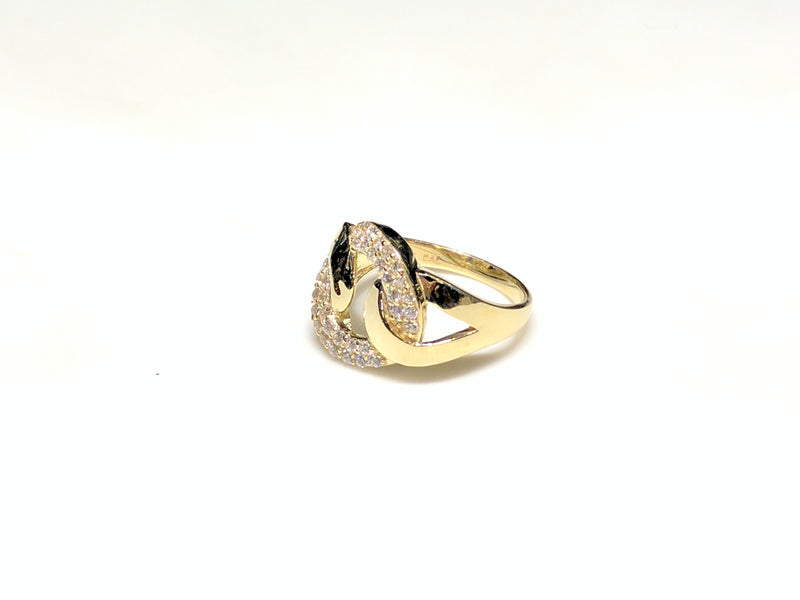 In the center: a 10 karat yellow gold lady's ring in the shape of a flat round link set with cubic zirconia in a micro pave setting laying on its side facing viewera different angle made by Popular Jewelry in New York City