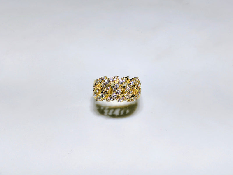 In the center: a 10 karat yellow gold wide cuban link ring iced out with pave set cubic zirconia standing up bird's eye view made by Popular Jewelry