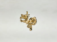 In the center: a 14 karat yellow gold diamond cut eastern asian dragon laying flat frontal view - Popular Jewelry
