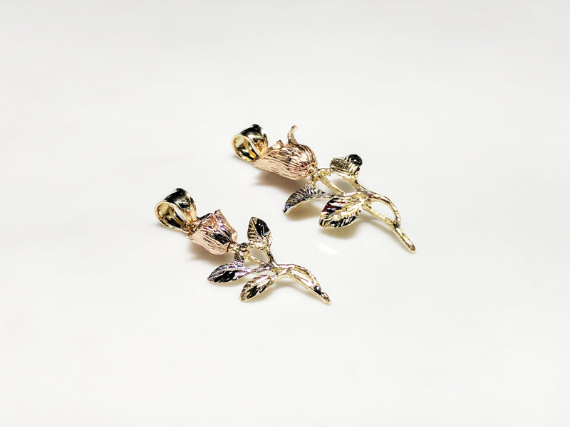 From left to right: a small (36 mm) and large (42.5 mm) long stemmed rose pendant in 14 karat gold with rose gold petals laying flatalternate angle to viewer made by Popular Jewelry in New York City