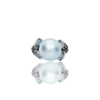 Bague torsadée perle et diamant (18 carats)