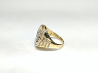 Side view of a 10 karat yellow gold signet ring with a white marijuana leaf embedded inside a bezel iced out with cubic zirconia - Popular Jewelry New York