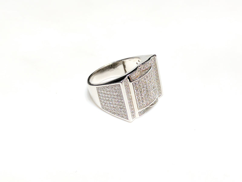 In the center: white sterling silver men's rings set with cubic zirconia in a micro pave setting laying flatangle view made by Popular Jewelry in New York City