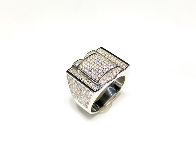 In the center: white sterling silver men's rings set with cubic zirconia in a micro pave setting standing upangle view made by Popular Jewelry in New York City