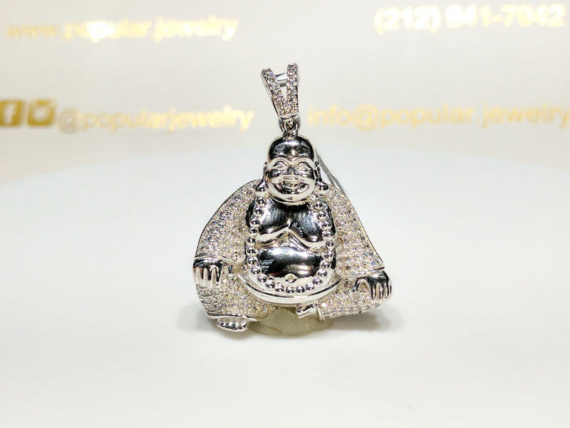 In the center: a sterling silver Seated Laughing Buddha Pendant iced out with cubic zirconia set in micropave style made by Popular Jewelry in New York City