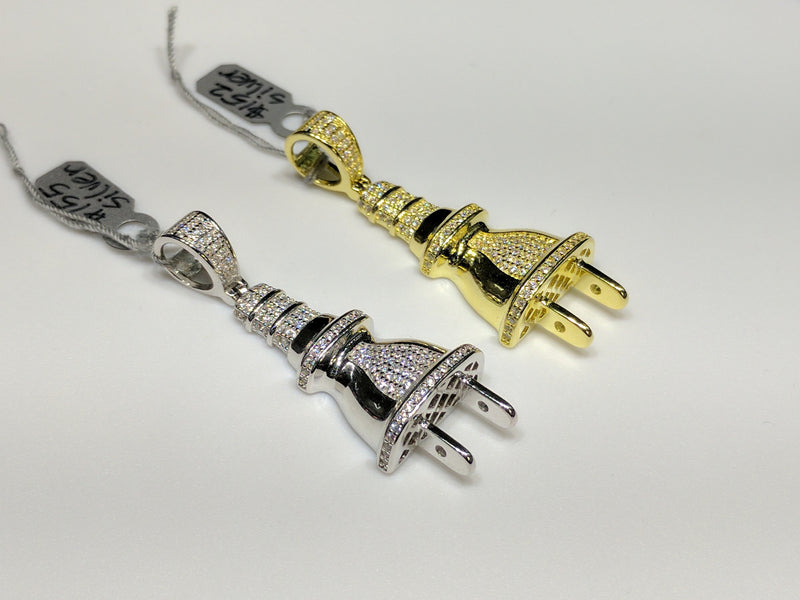 From left to right: two white and yellow colored sterling silver electrical plug pendants with cubic zirconia set in micropave style - Popular Jewelry